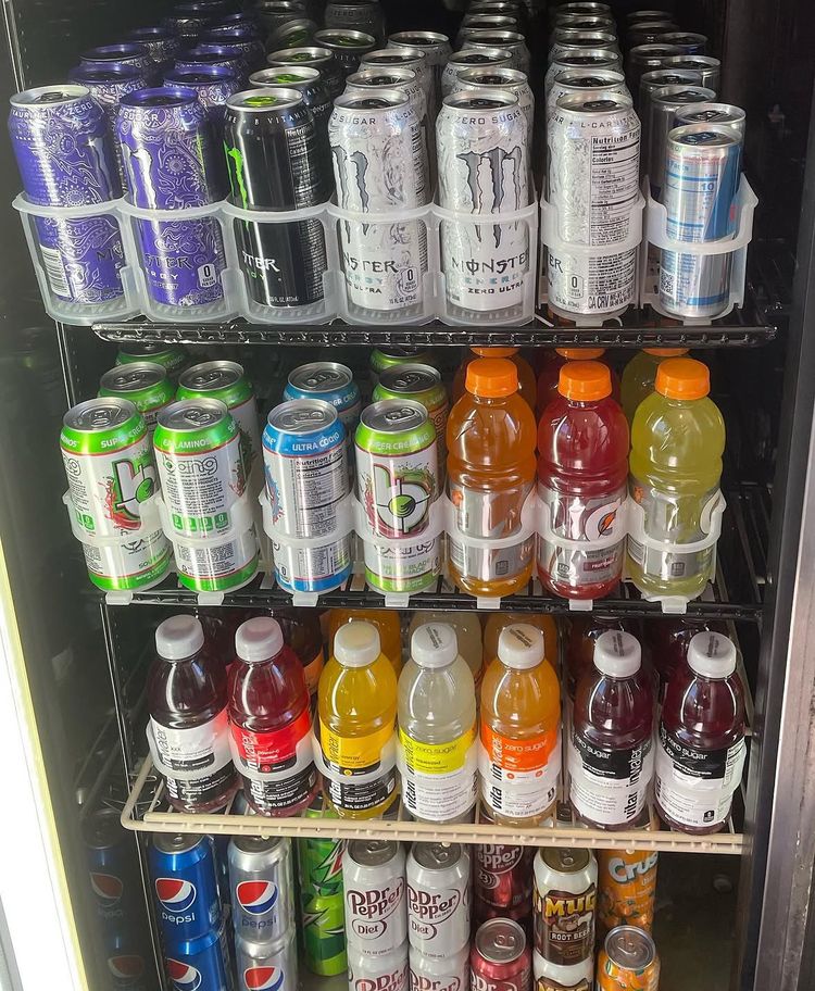 Cooler stocked with sodas, juices, teas and energy drinks