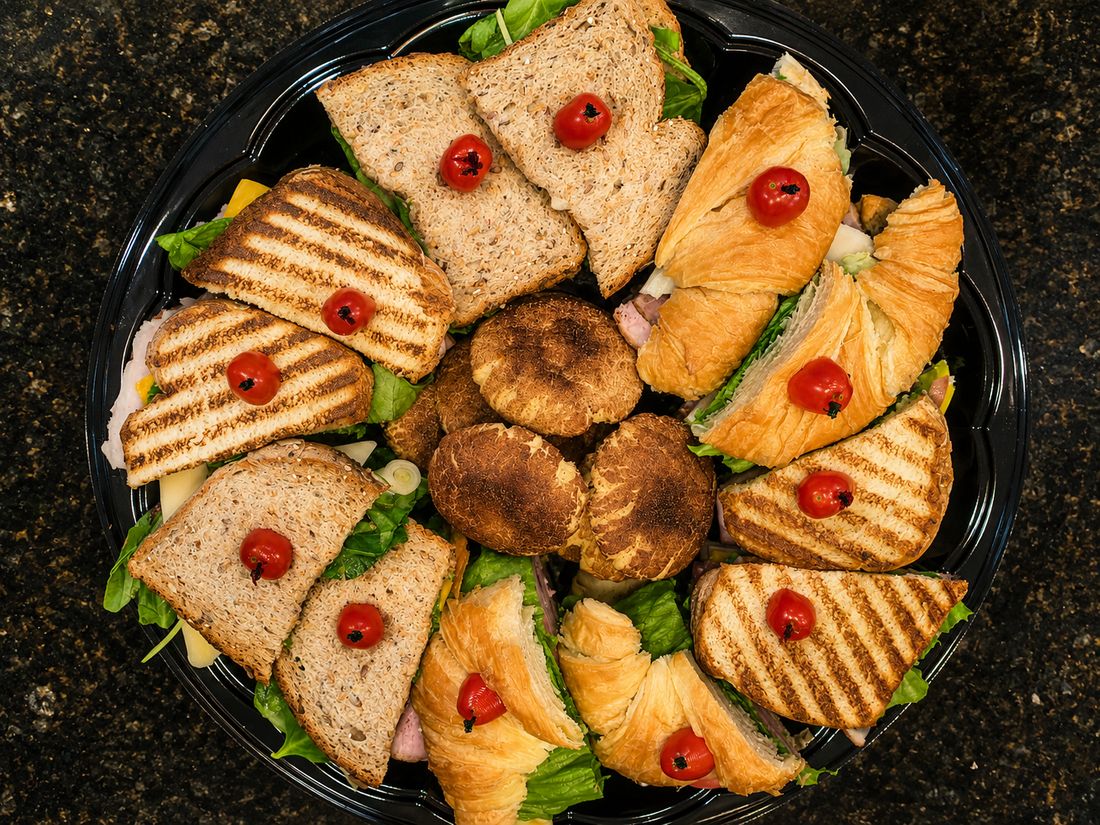 Sandwich and croissant platter arranged for a corporate lunch