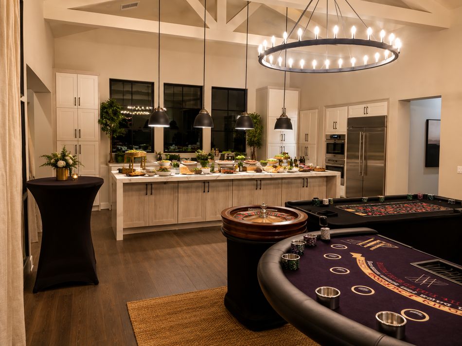 Event room set with cocktail tables and a buffet station